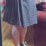 Step 7: Determine where the front will overlap and fold over. Add a belt to hold your new Kilt together.